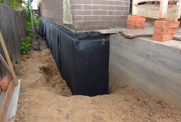 Happy homeowners after waterproofing job in Rock Island